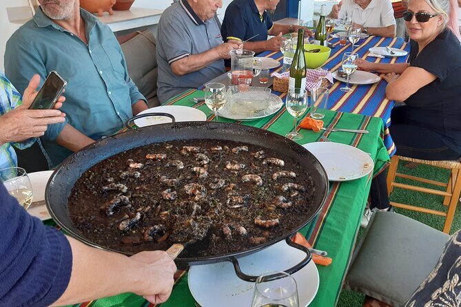 Chefcooking Paella from our Andalusian Grandmother at a Family Farm - The hands-on paella de la Abuela Andaluza cooking moment