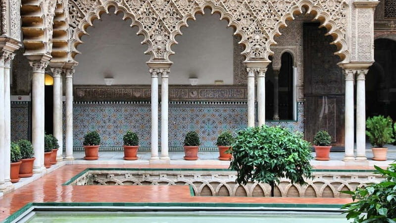 From Malaga: Seville Day Trip with Real Alcázar Tickets - Puerta de Jerez and the Santa Cruz guided walk
