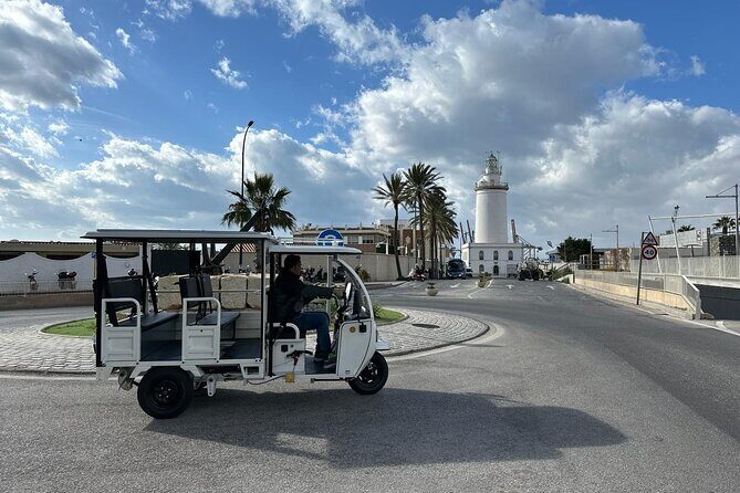 Malaga by Tuk Tuk i : 1 or 2 hours Private city tour - La Farola lighthouse: built for the port entrance