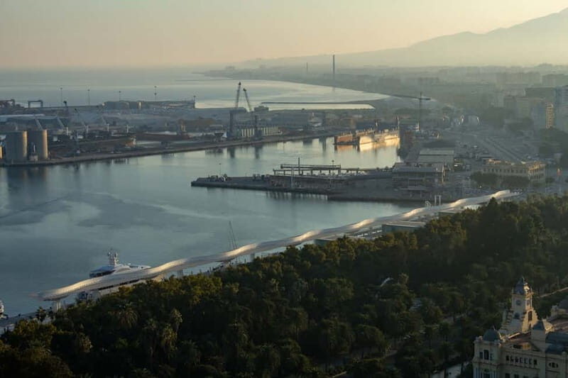 Malaga: Private Walking Tour with Official Guide - Port life and sea air: lighthouse, Malagueta beach, and seafood habits