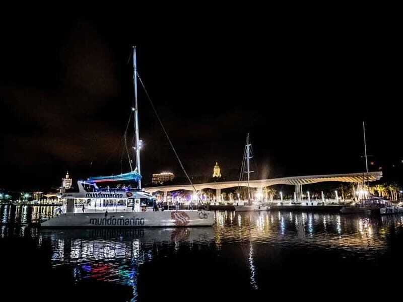Malaga: Sailing Catamaran Sunset Cruise with Live DJ & Drink - Malaga’s skyline lights up: romantic night views from the sea