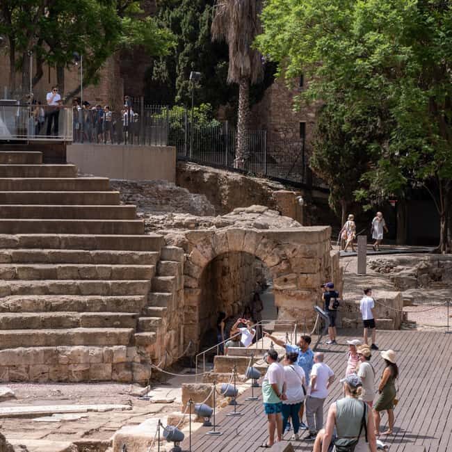 Malaga Walking Tour, Roman Theater and Alcazaba in small group with Tickets - El Pimpi and Church of Santiago: where local character shows up