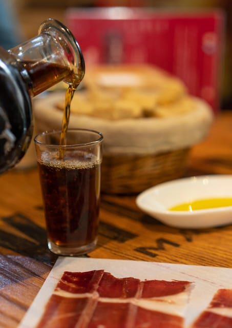 Málaga: Wine & Tapas Tour - Stop 1: A traditional tavern and the first wine wow