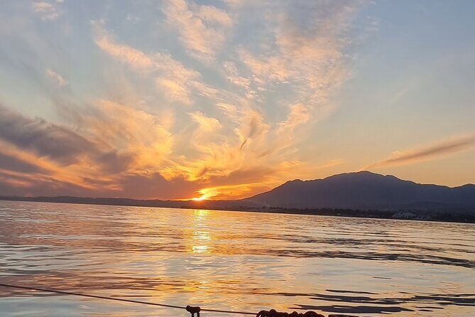 Marbella- sunset from a sailboat with drinks - Drinks, Snacks, and the Captain’s Role: Why Hospitality Is the Main Attraction
