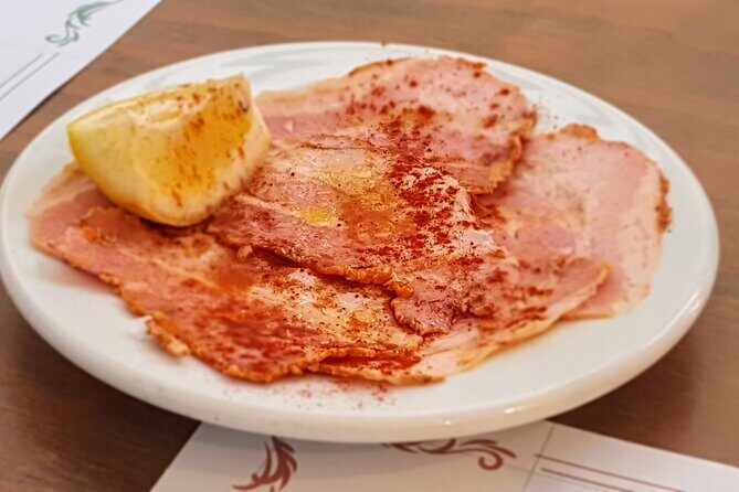 Taste of Malaga Tour : Tapas, History and Local Customs - Ultramarinos in Plaza Enrique Garcia Herrera: Ham, Vermouth, and the Old-School Grocery Mindset